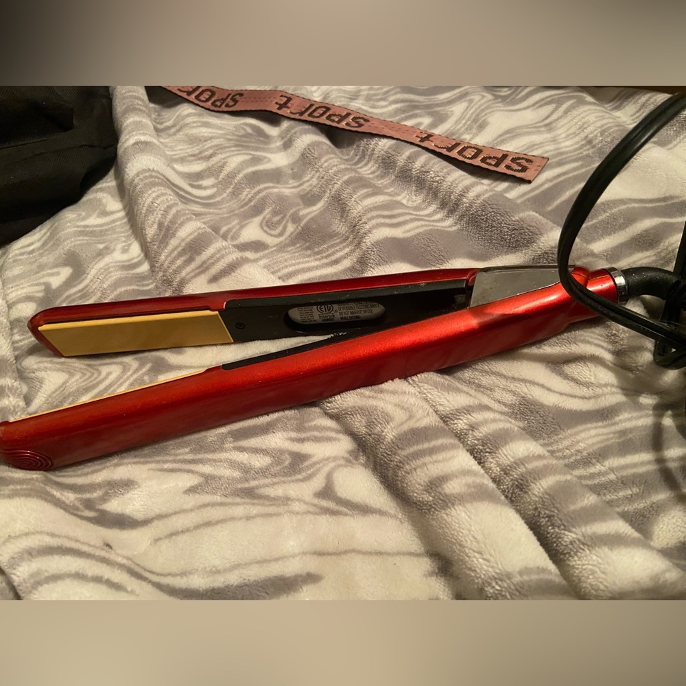 A Red Revlon 3X Ceramic Smooth Glide Perfect Heat hair straightener